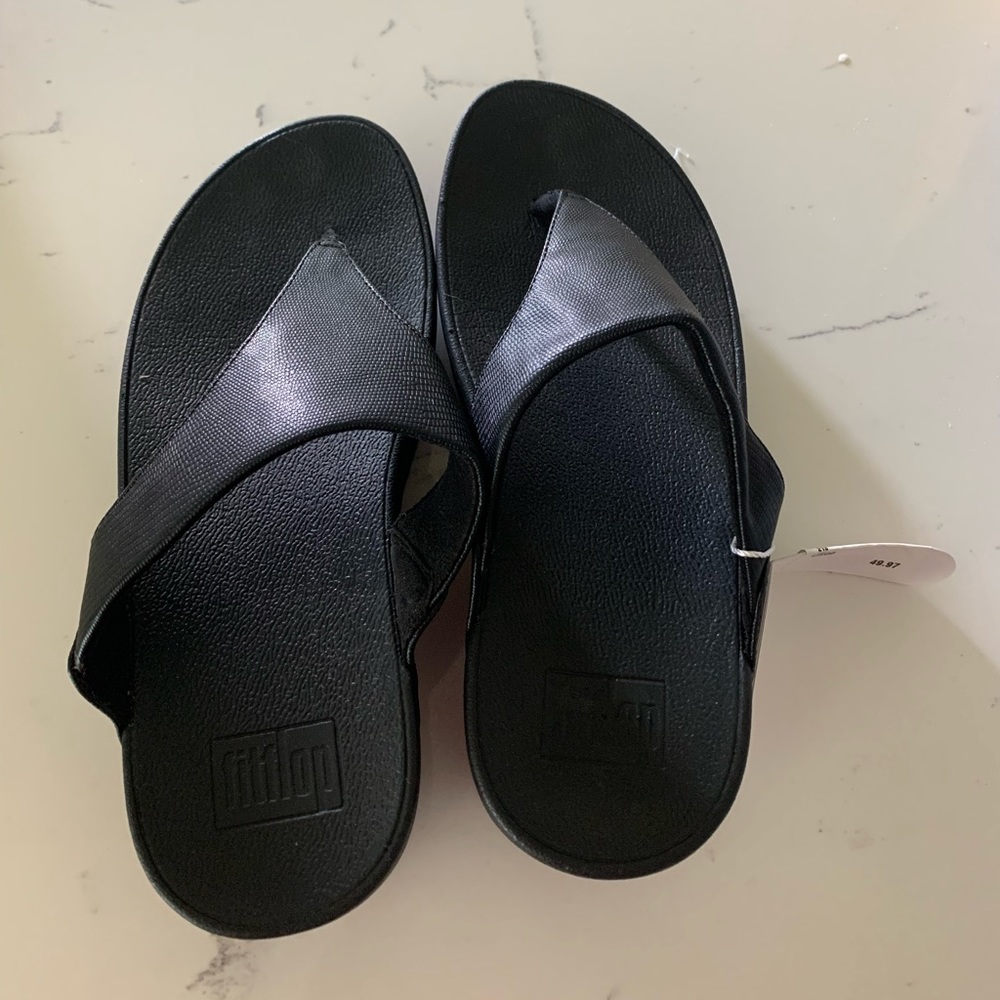 New black slippers that I bought and never used